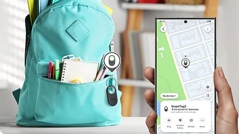 A teal backpack with a Galaxy SmartTag2 on it and a mobile phone showing its location.