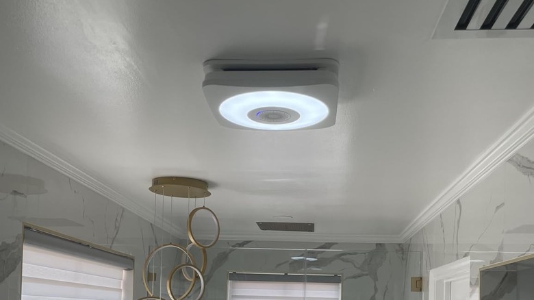 OREiN bathroom fan in use with the LED lights on
