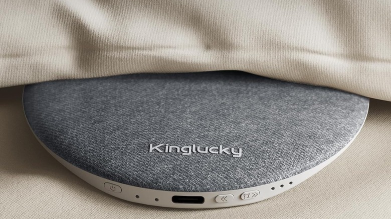 Kinglucky Pillow Speaker half under a pillow, half out.