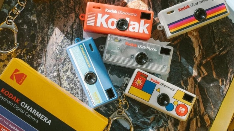 Various versions of the Kodak Charmera Keychain Digital Camera laid out.