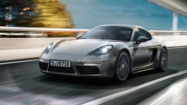 A silver 2025 Porsche 718 driving