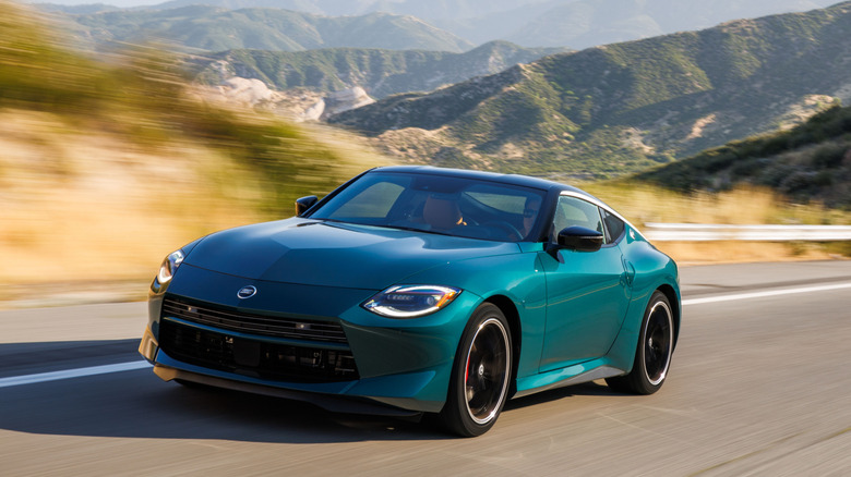 A green 2027 Nissan Z driving