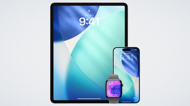 iPad, iPhone, and Apple Watch together on a white background