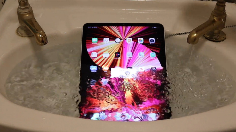An iPad M1 Pro submerged in a sink of filling water