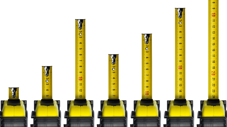 Tape measures extended out to different lengths