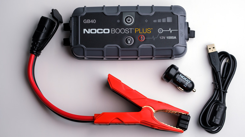 NOCO Boost Plus GB40 jump starter with accessories on white background.