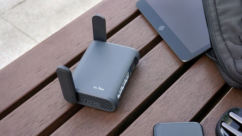 Travel router on a wooden bench