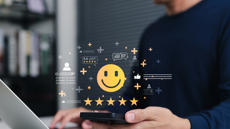 Holographic image of a smiley face and five stars.