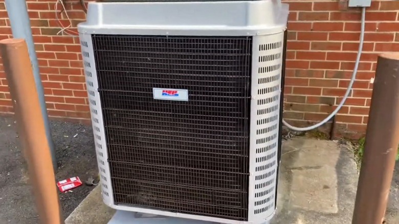 Heil air conditioner outside a red brick building