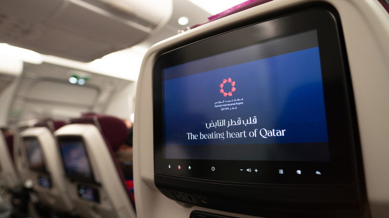 Qatar Airways economy-class in-flight entertainment.