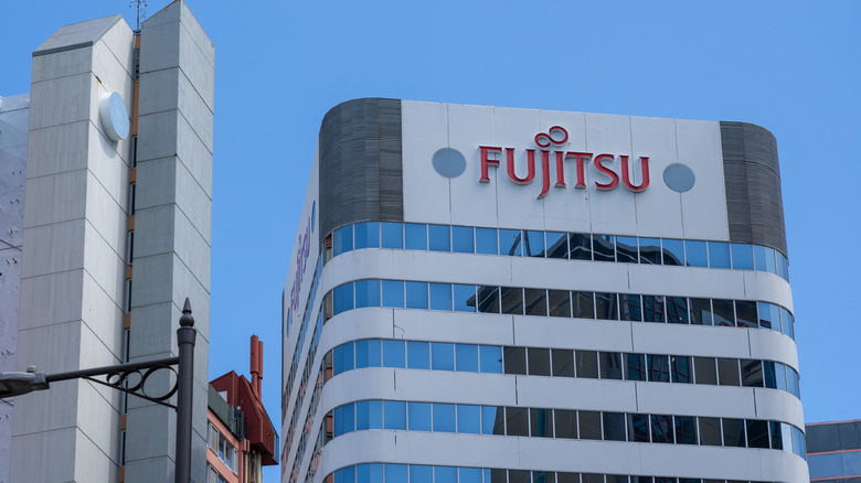 Fujitsu signboard on an office building.