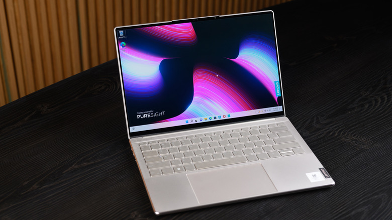 A white Lenovo Yoga resting on a table.