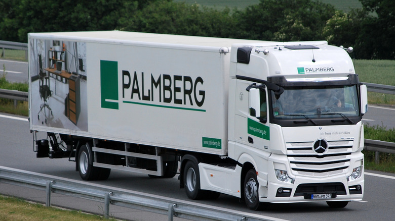 White Mercedes-Benz Actros seen from right front on highway