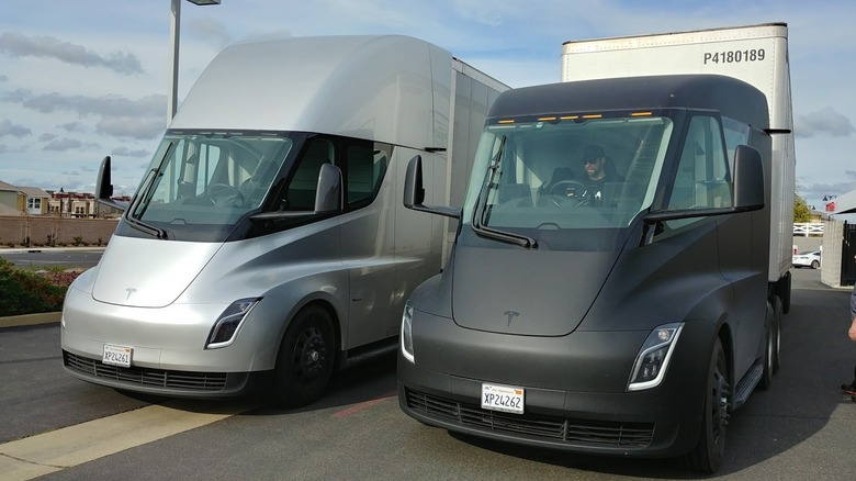 Two Tesla Semi trucks side by side seen from left front