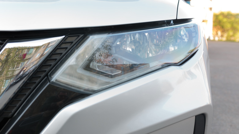 A closeup of a car's headlight components.