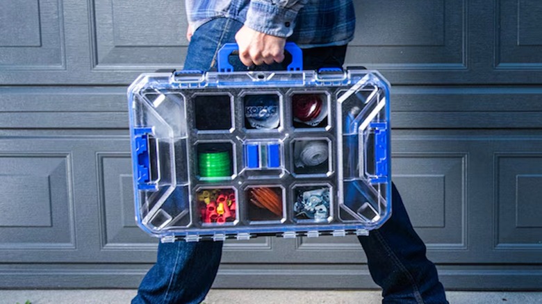 Person carrying a Kobalt CaseStack toolbox full organizer
