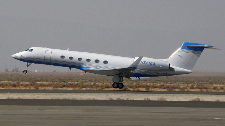 Gulfstream V jet taking off from an airport