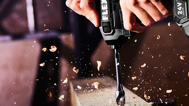 Drilling into wooden board with Flex impact driver.