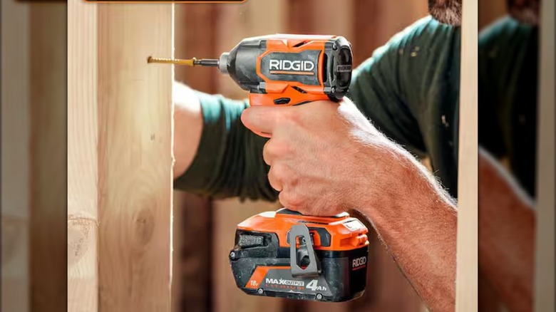 Driving a fastener with Ridgid impact driver.