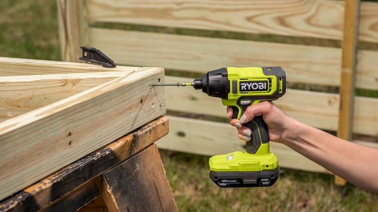 Building a timber frame with Ryobi impact driver.