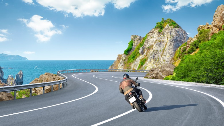 Lone motorcycle on cliffside 