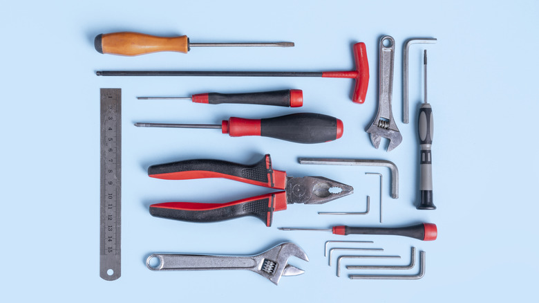 Several tools arranged against a blue background