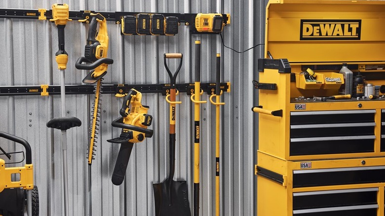 DeWalt tools hanging in a metal shed