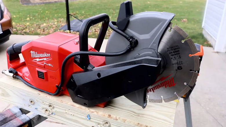 The Milwaukee M18 Fuel One-Key Circular Saw laid atop a piece of lumber