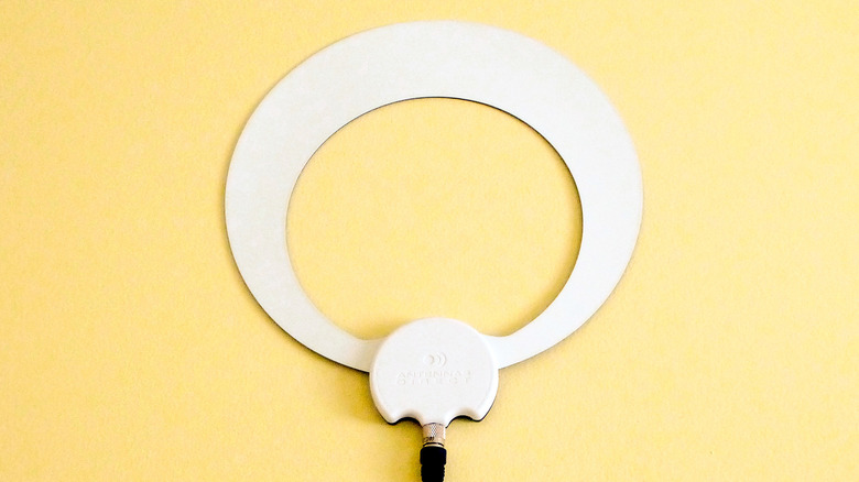 The Antennas Direct ClearStream Eclipse indoor TV antenna on a yellow background