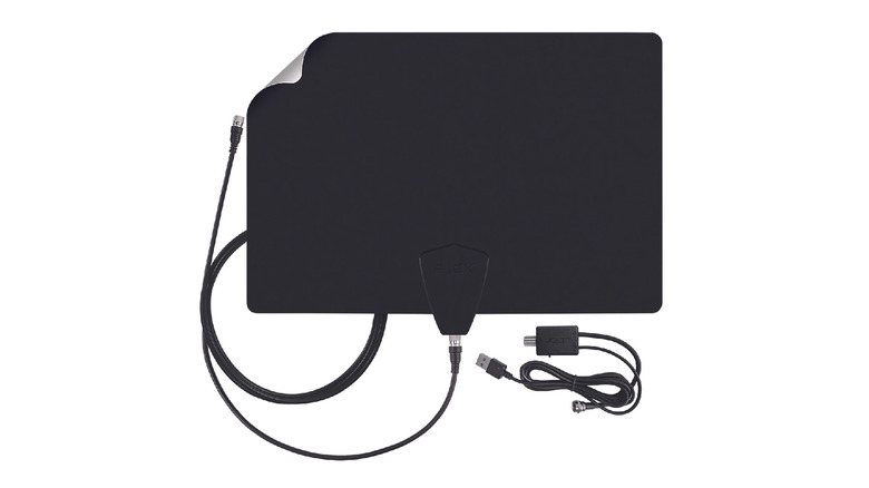 A flat indoor TV antenna on a white surface