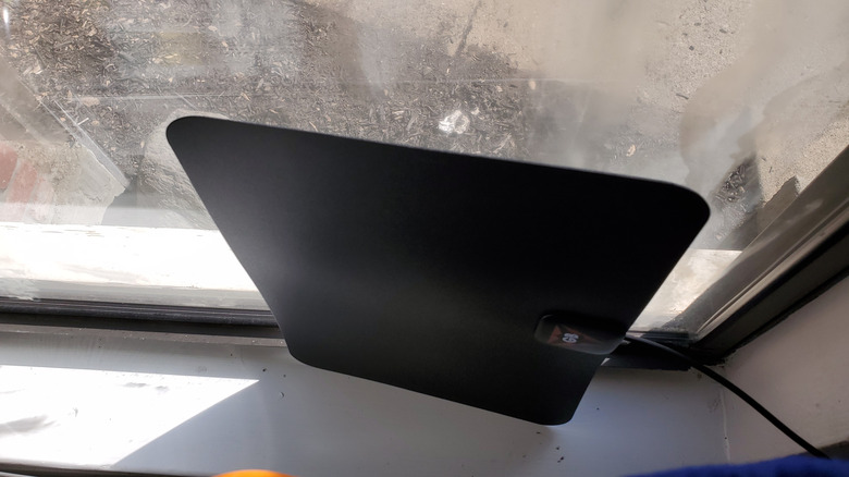 An indoor antenna placed against a window