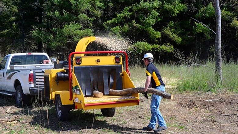 Vermeer 12-inch BC1000XL wood chipper in use