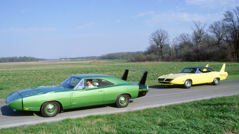 Dodge Charger Daytona (and Plymouth Superbird parked on country road, left-side view