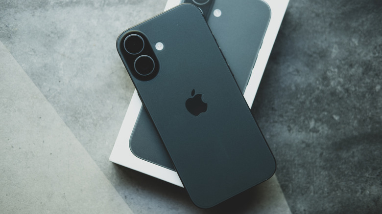 iPhone 17 on top of its box