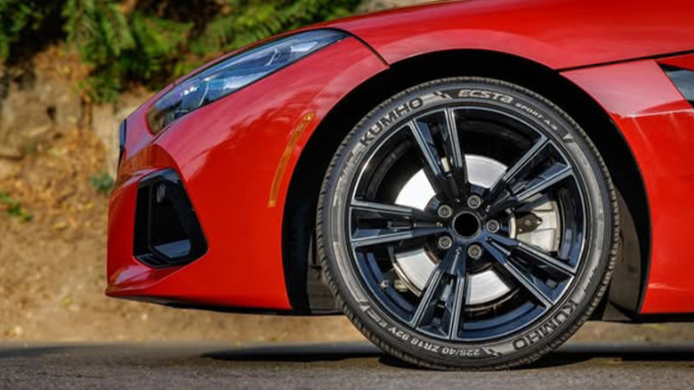 A red sports car with a Kumho Ecsta Sport S tire