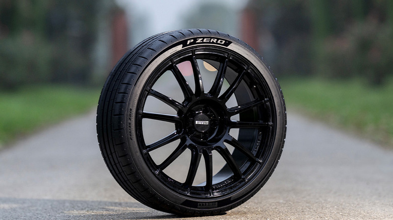 A lone Pirelli P Zero PZ5 on a small road near some trees