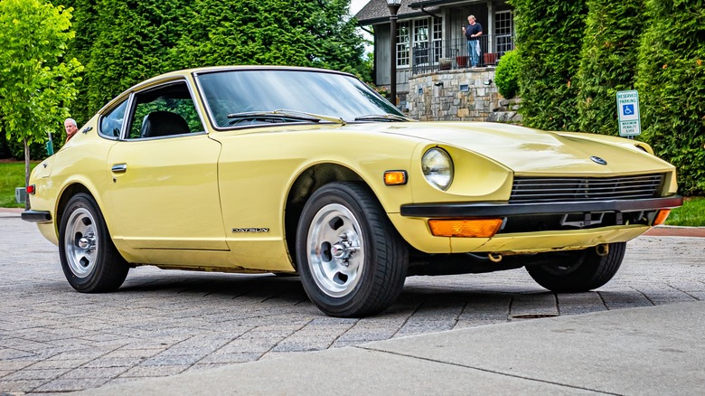 Stock Datsun 240Z leaving a show