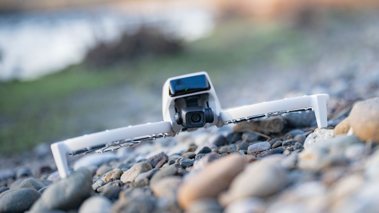 DJI Flip sitting on a rocky surface