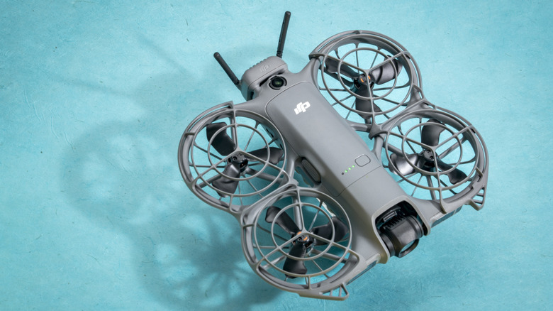 DJI Neo 2 sitting on a light blue surface