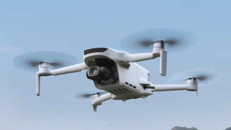 Potensic Atom 3 flying in an open field