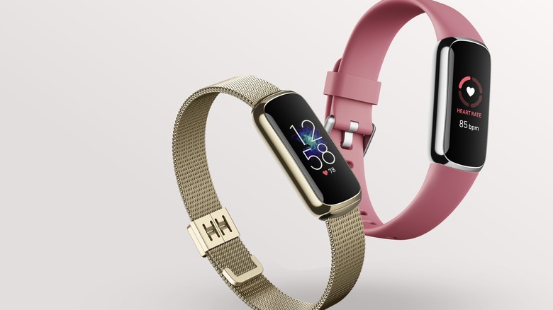 Fitbit Luxe Fitness and Wellness Tracker smartwatches, gold and pink