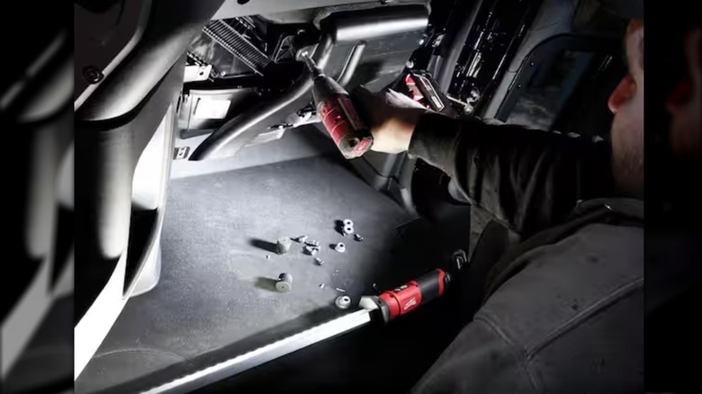 fixing a car using M12 underhood light