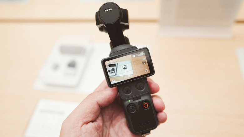 A person using the DJI Osmo Pocket 4