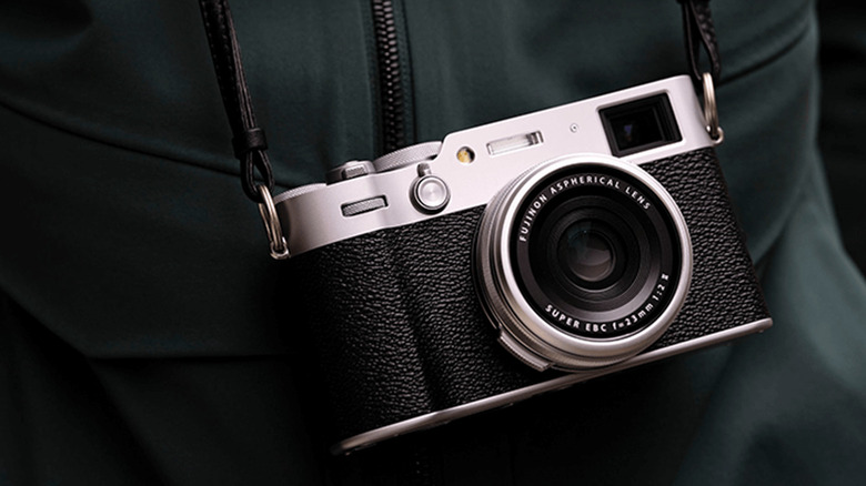 Fujifilm X100VI hung on a person's nec
