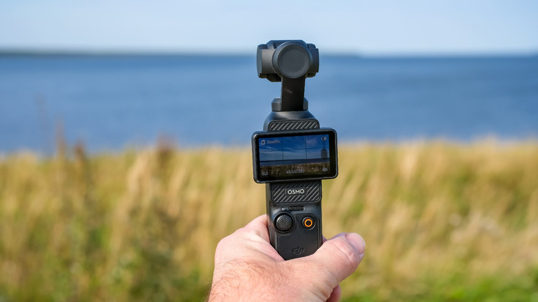A person shooting a video with the Osmo Pocket 3