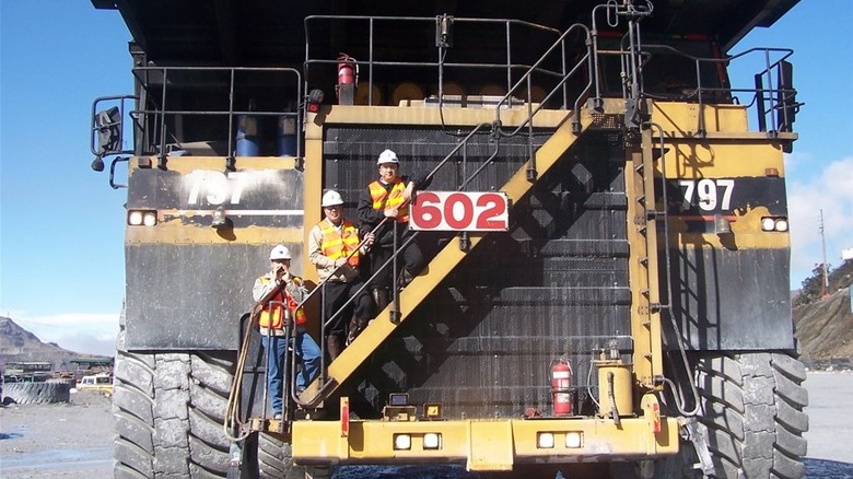Three crewman aboard a Cat 797F mining truck