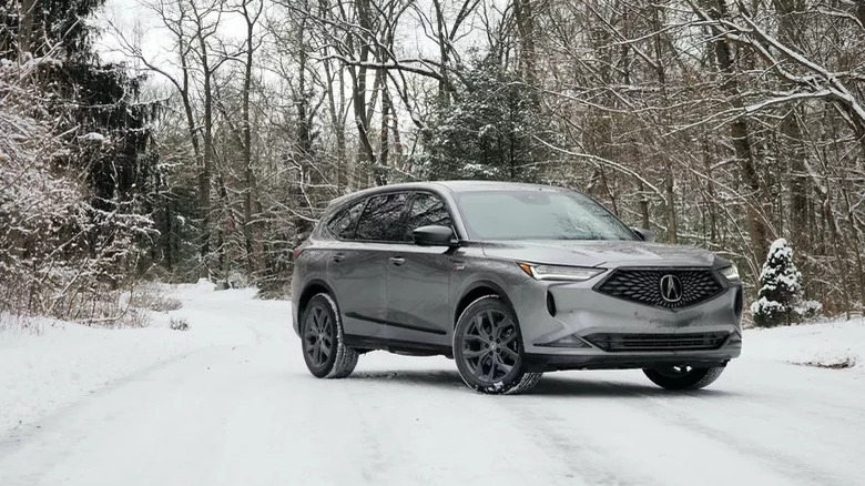 2022 Acura MDX in snowy woodland