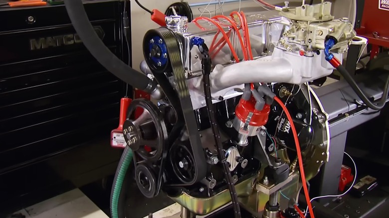 A polished aftermarket Ford 2.3L Lima engine sitting on a dyno test stand, and wired up before a performance run.