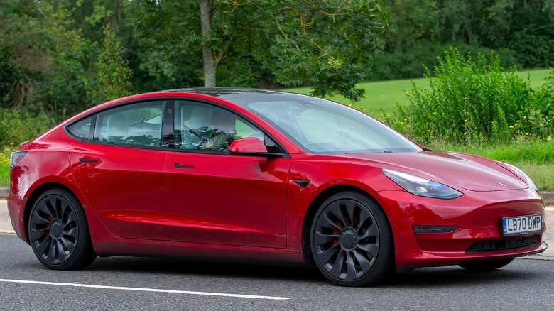 Tesla driving down country road