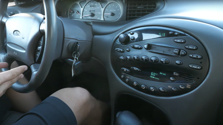 The interior of the third generation Ford Taurus, driver in the driver's seat